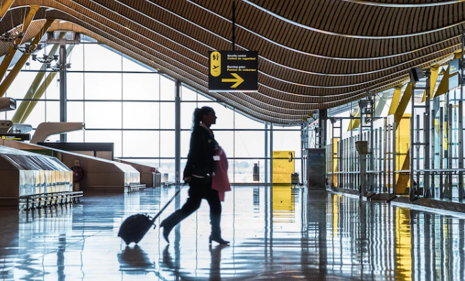 Lady Leaving the airport with her luggage early