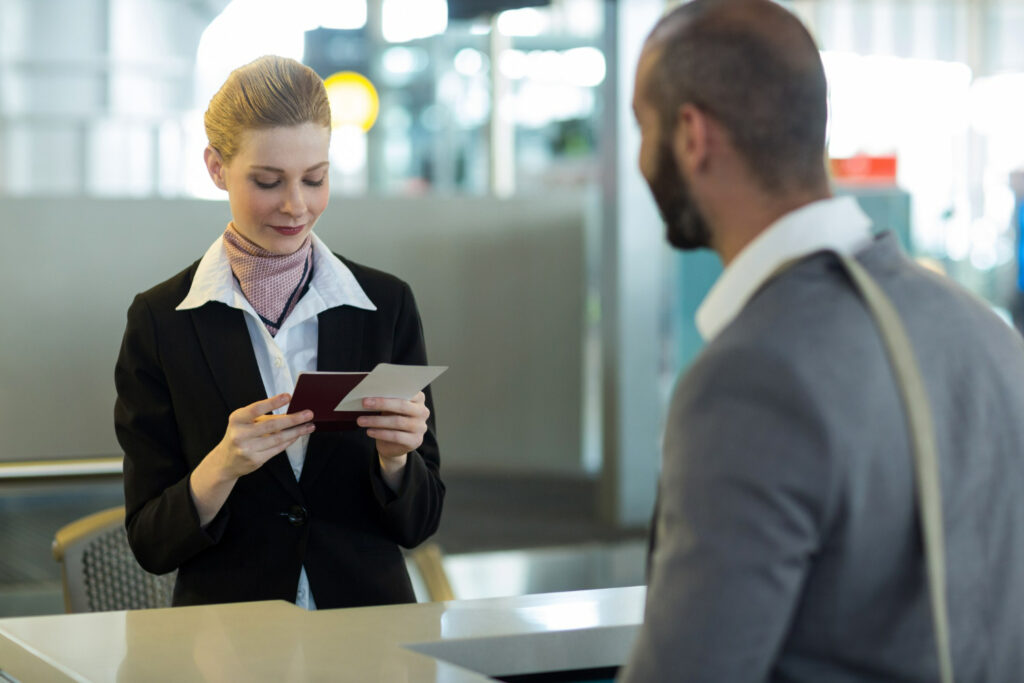 A lady scanning passport at the airport but it won't scan