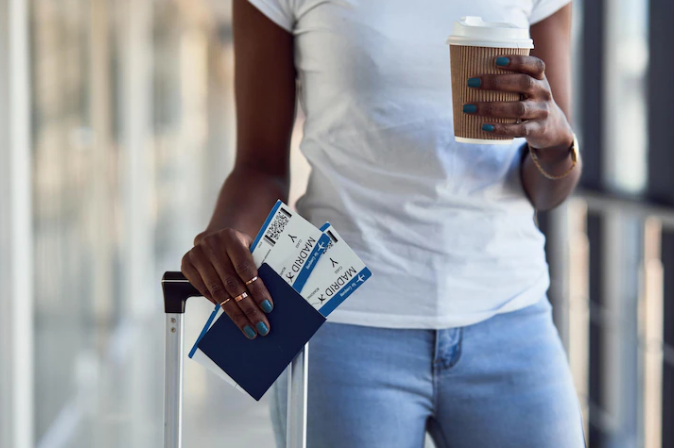 african lading holding travel documents and asking what to do with old passports