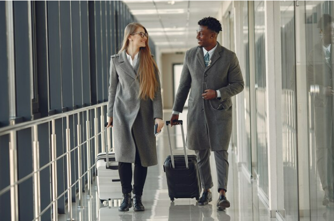 Man and his wife going to the baggage claim area