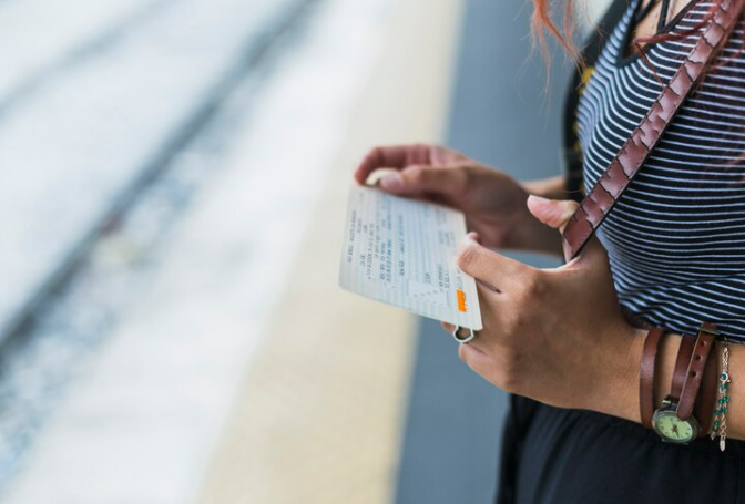 Lady with a gate pass gotten from the airport