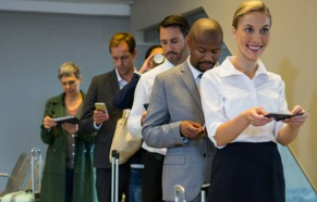 Men and women getting checked at the airport